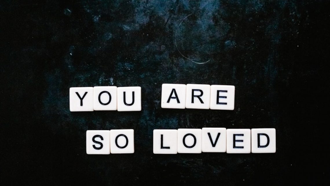 You are so loved spelt out using Scrabble letters flatlay